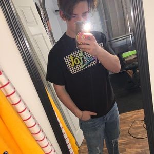 “Riot” checkerboard tee